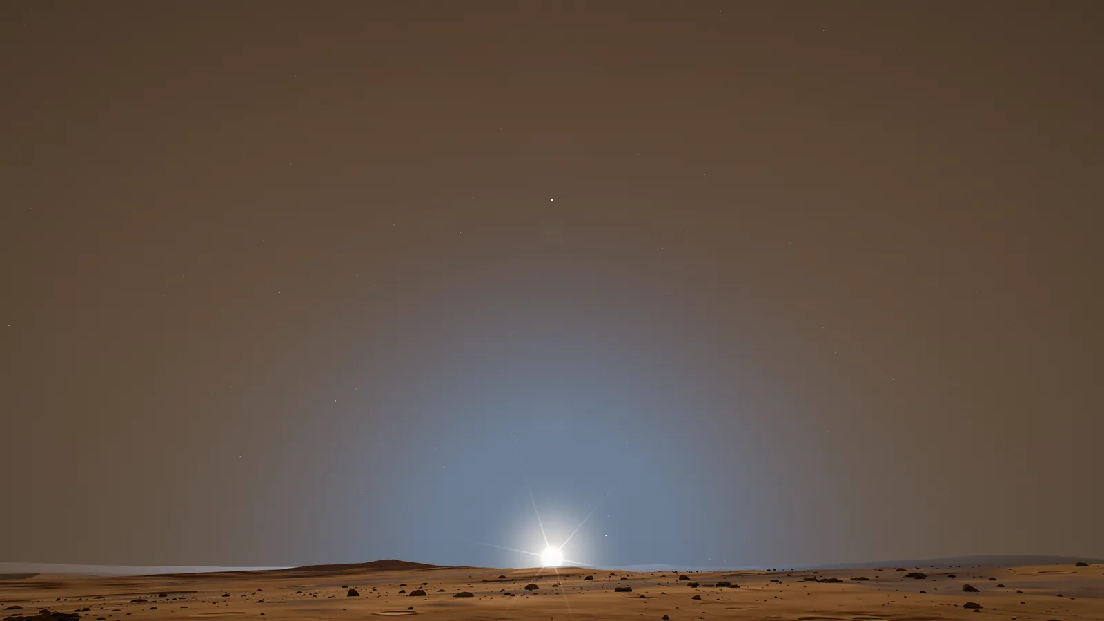 The Sun setting over the Martian horizon, seen from the surface.