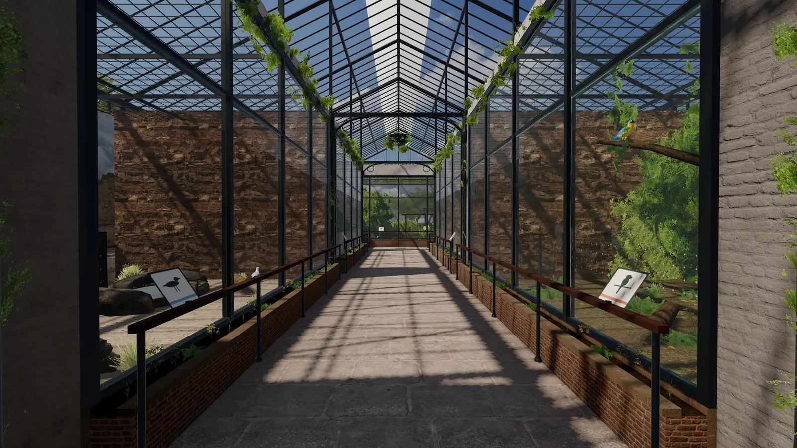 The long glasshouse aviary walkway under a steel and glass roof.