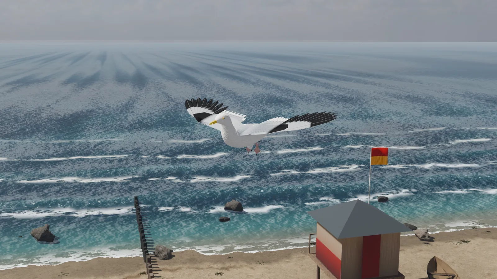 A gull gliding low over the waves by a lifeguard hut.