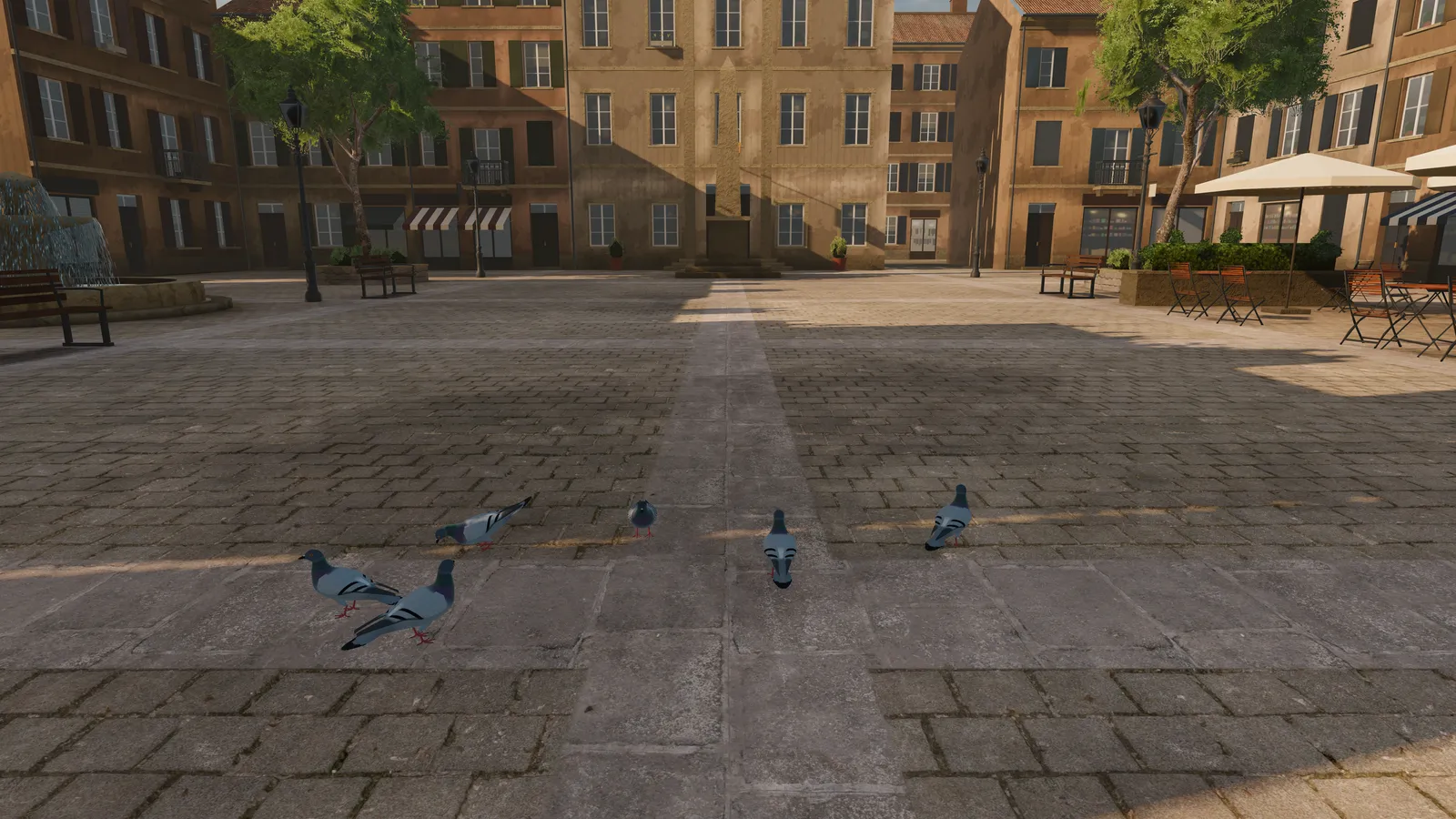 Pigeons in a small town square lined with ochre houses.
